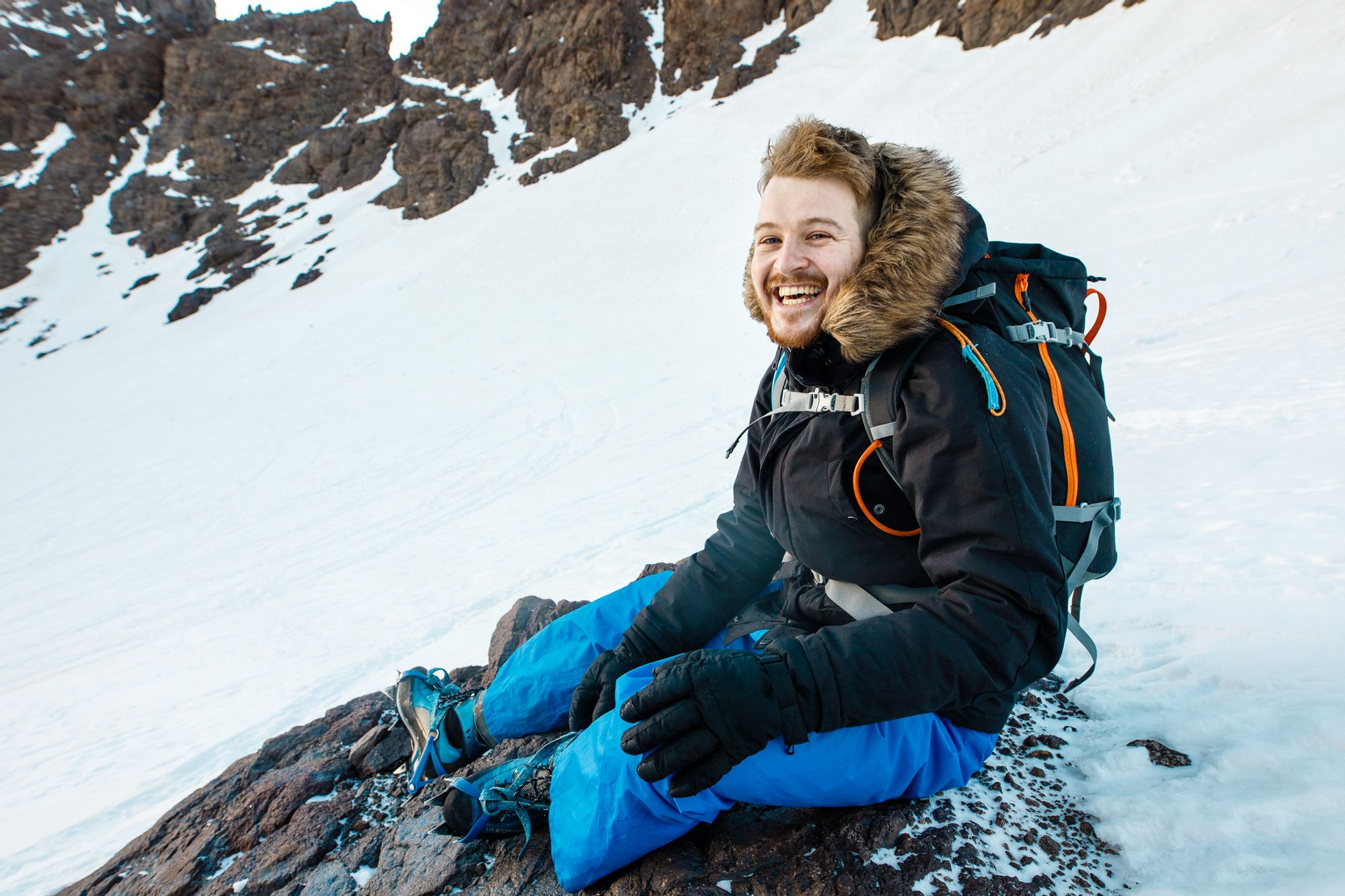 A hiker stops for a break on Mount Toubkal, Morocco