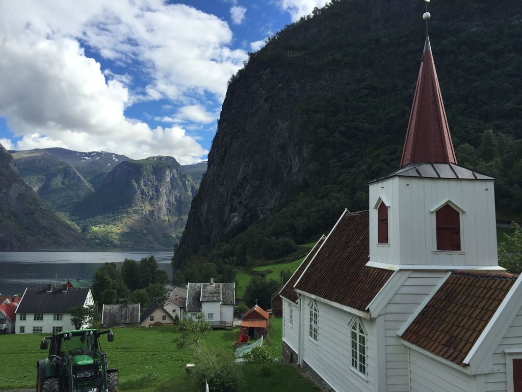 A traditional church and village in Norway's Naeroyfjord