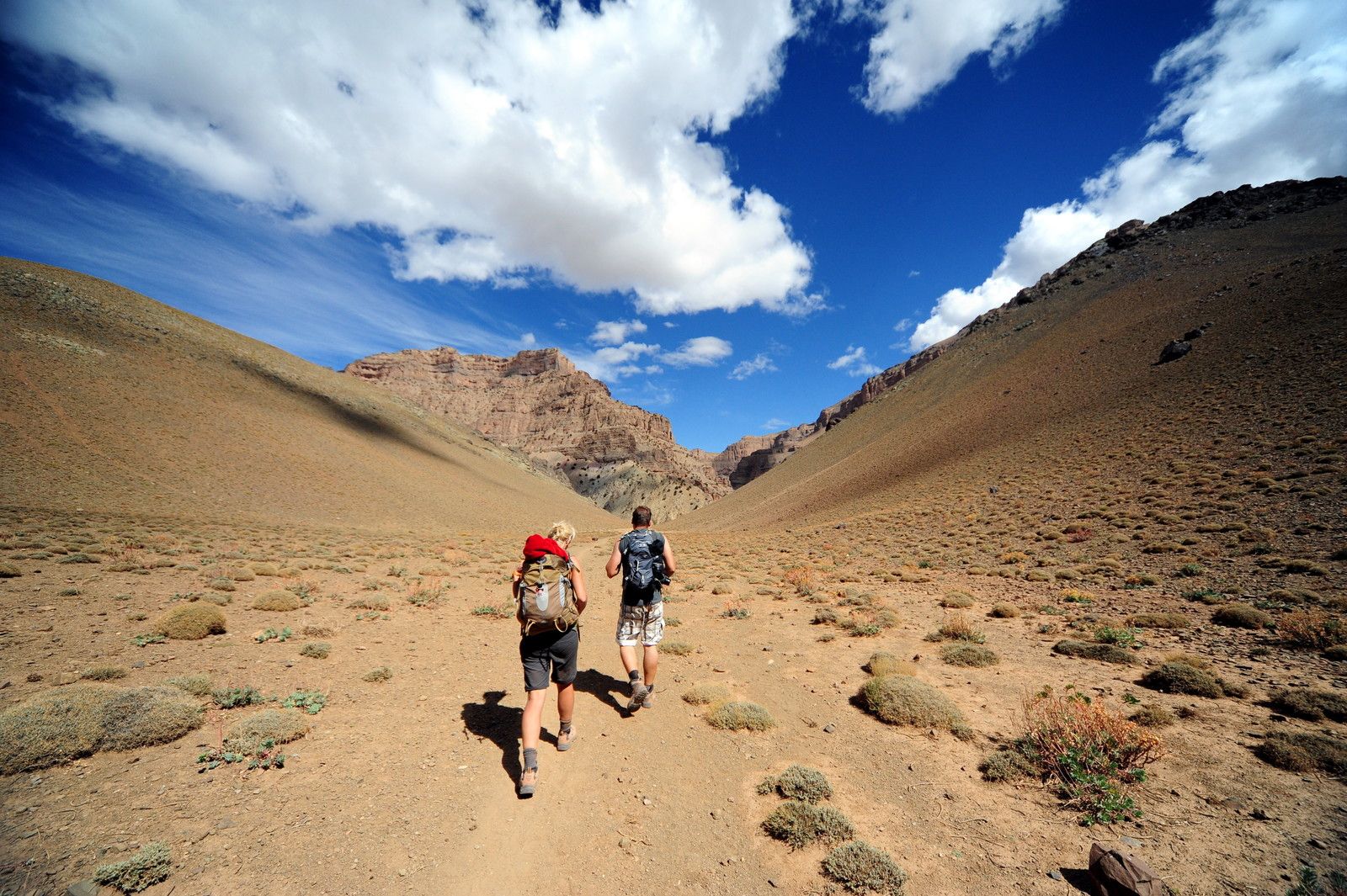 Two trekkers in Morocco's Atlas Mountains.