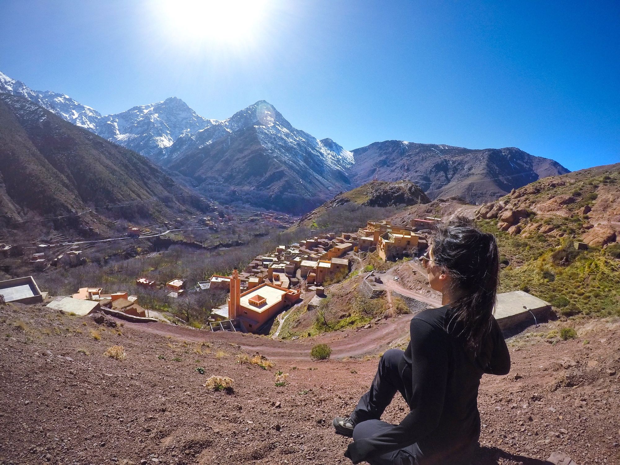 A woman poses in the Atlas Mountains of Morocco.