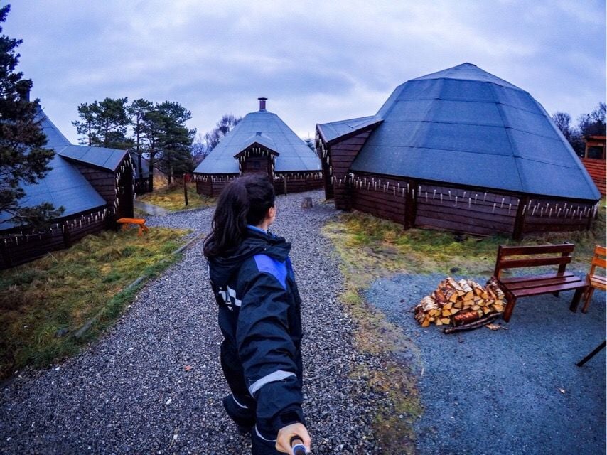 A woman takes a selfie at a campsite in Norway.