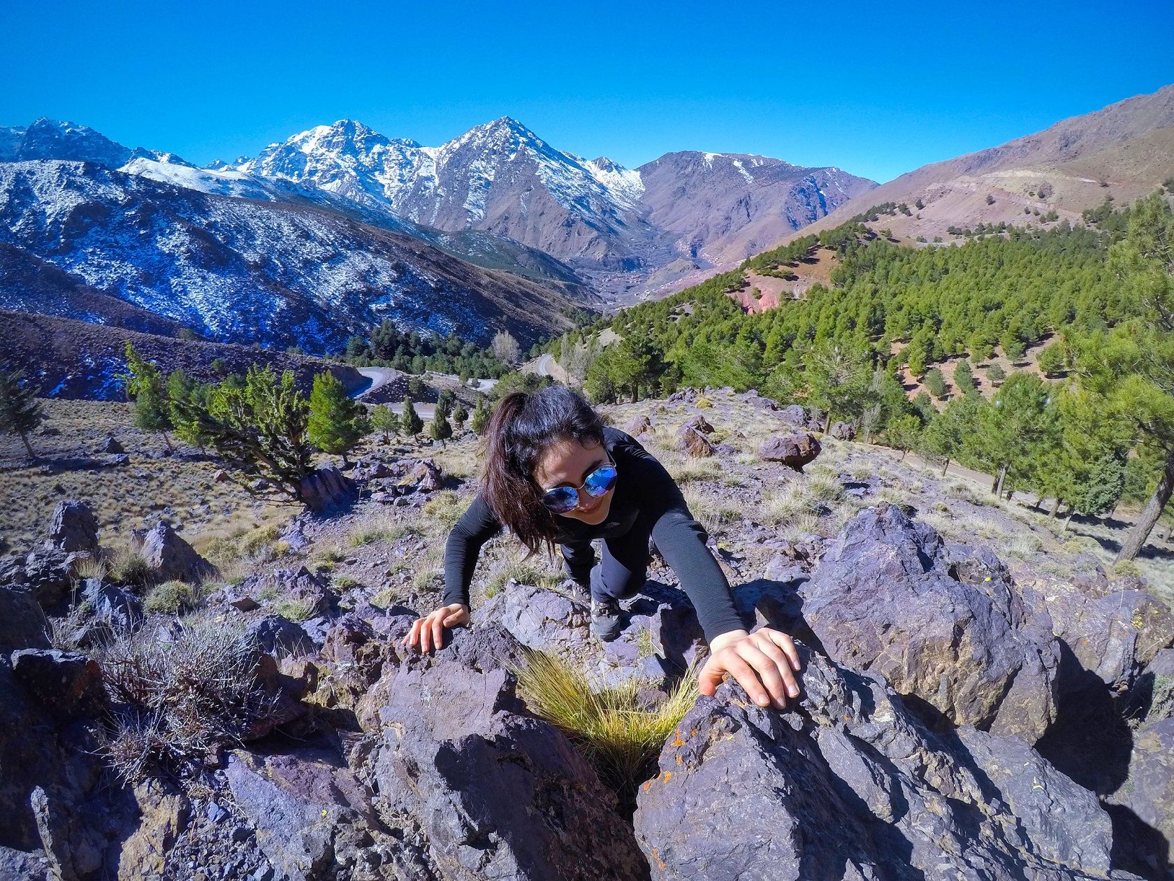 A woman climbing in the Atlas Mountains of Morocco.