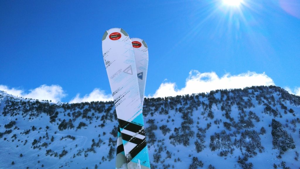 A classic photograph of a pair of skis, taken from a gondola.