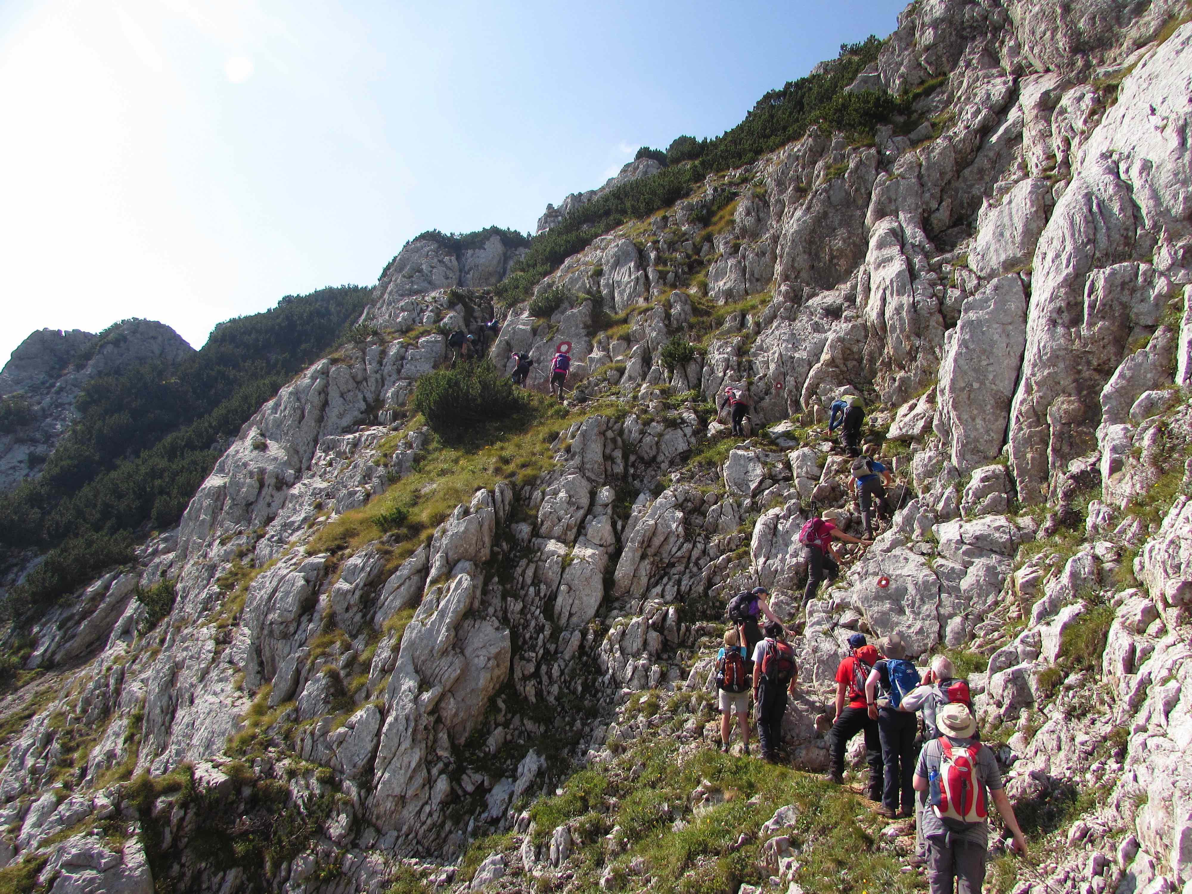 Hikers on a via ferrata on the Via Dinarica, Mount Maglic.