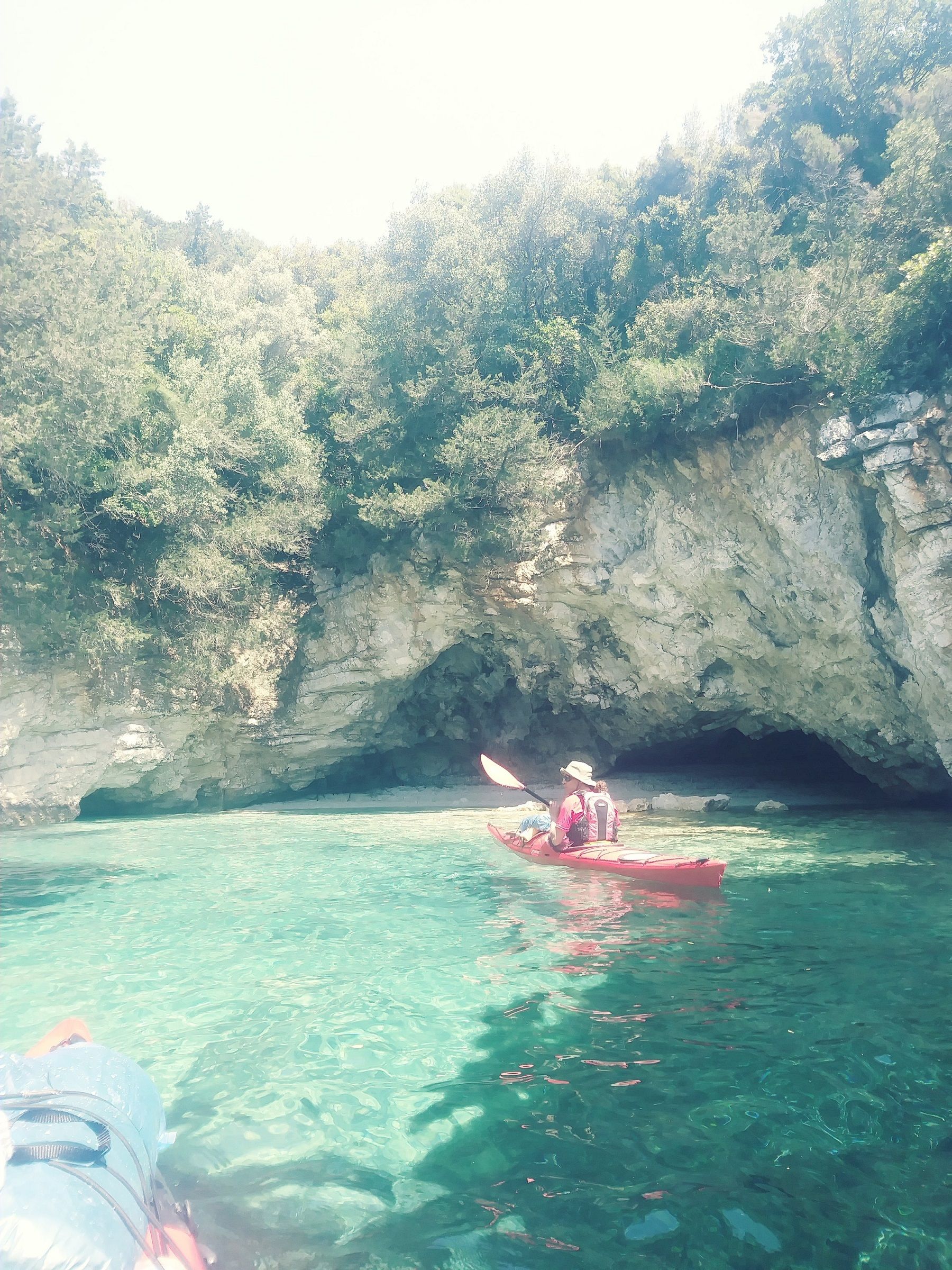 A sea kayaker off the coast of Lefkada, Greece.