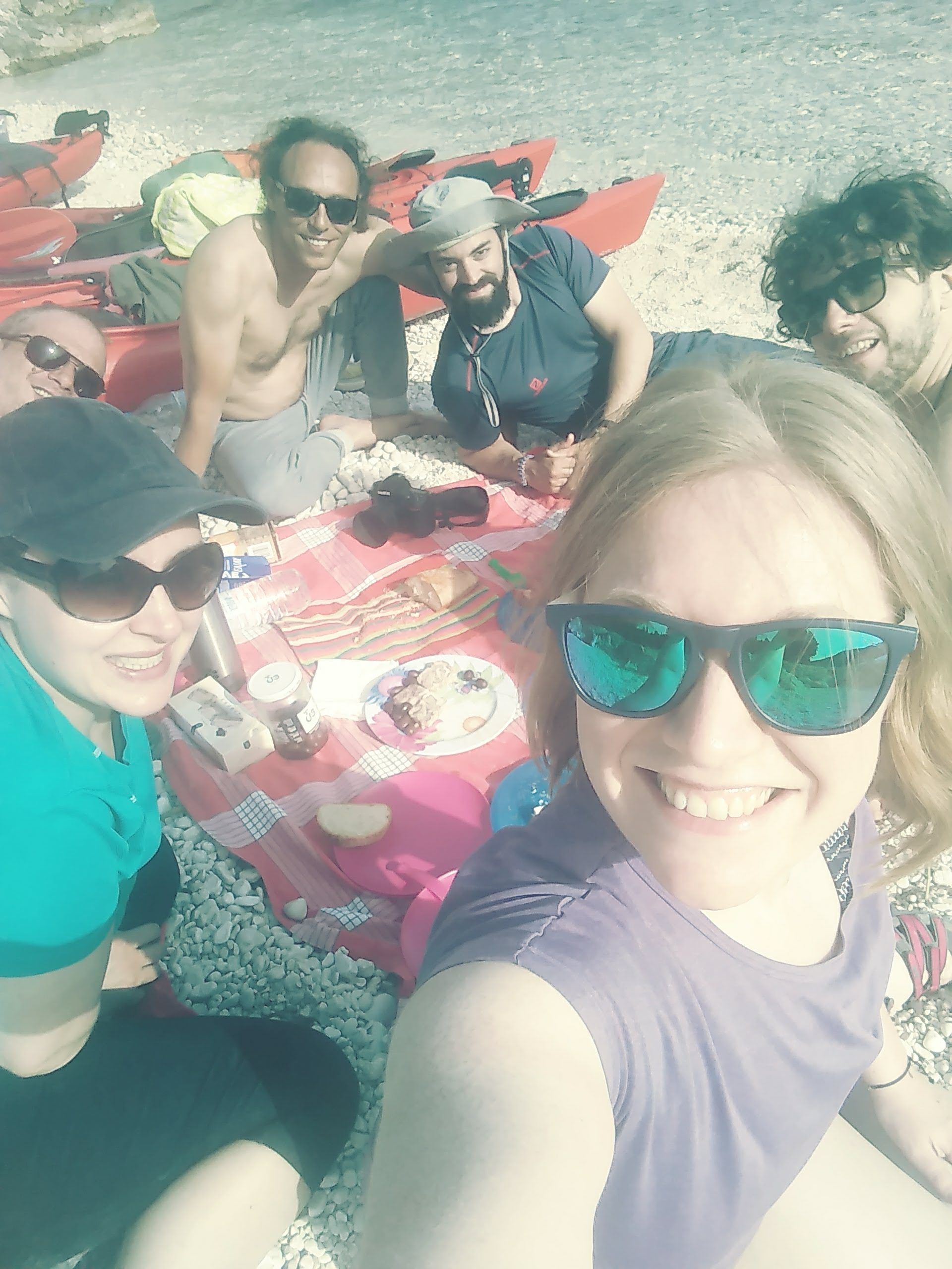 A group of travellers on Thilia Island, Greece.