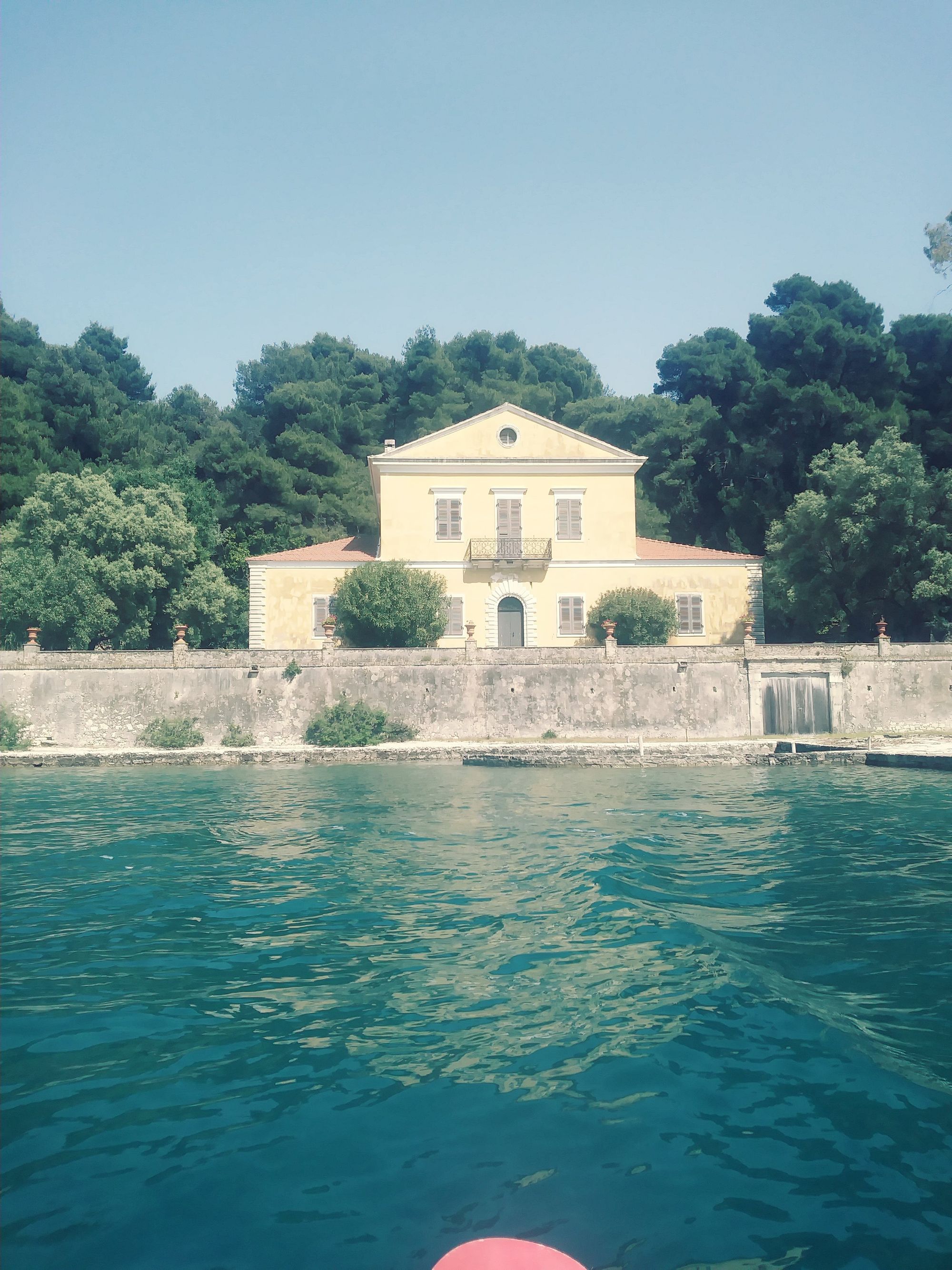 A yellow house on the waterfront in Greece