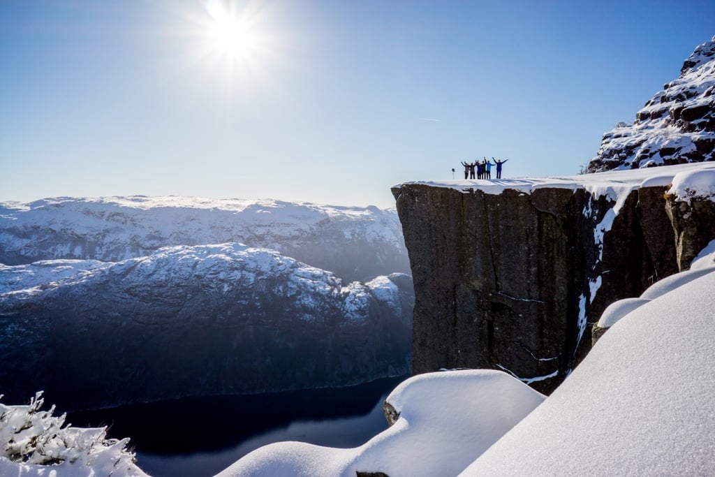 Hikers on a plateau in the Norwegian fjords