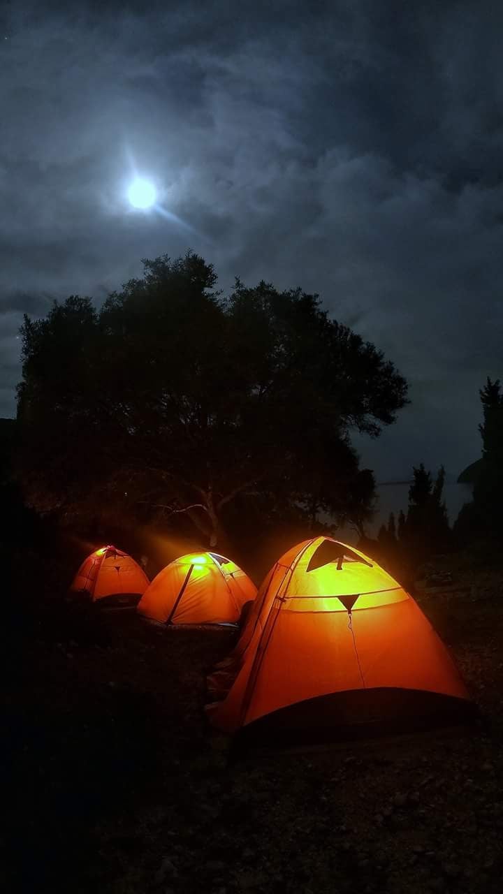Illuminated tents when wild camping in Greece.