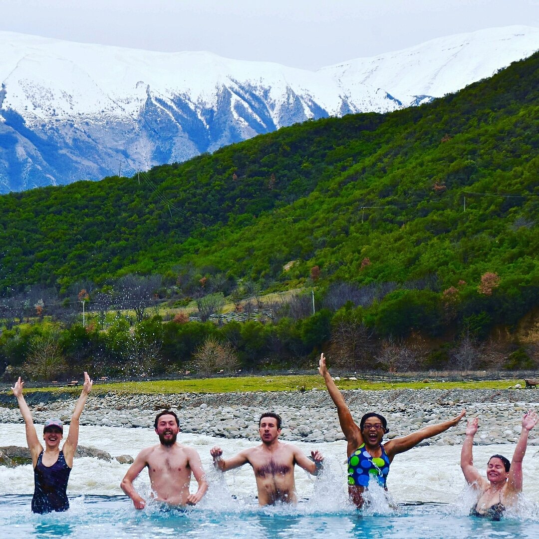 A group of people in the thermal springs of Benje, in Albania