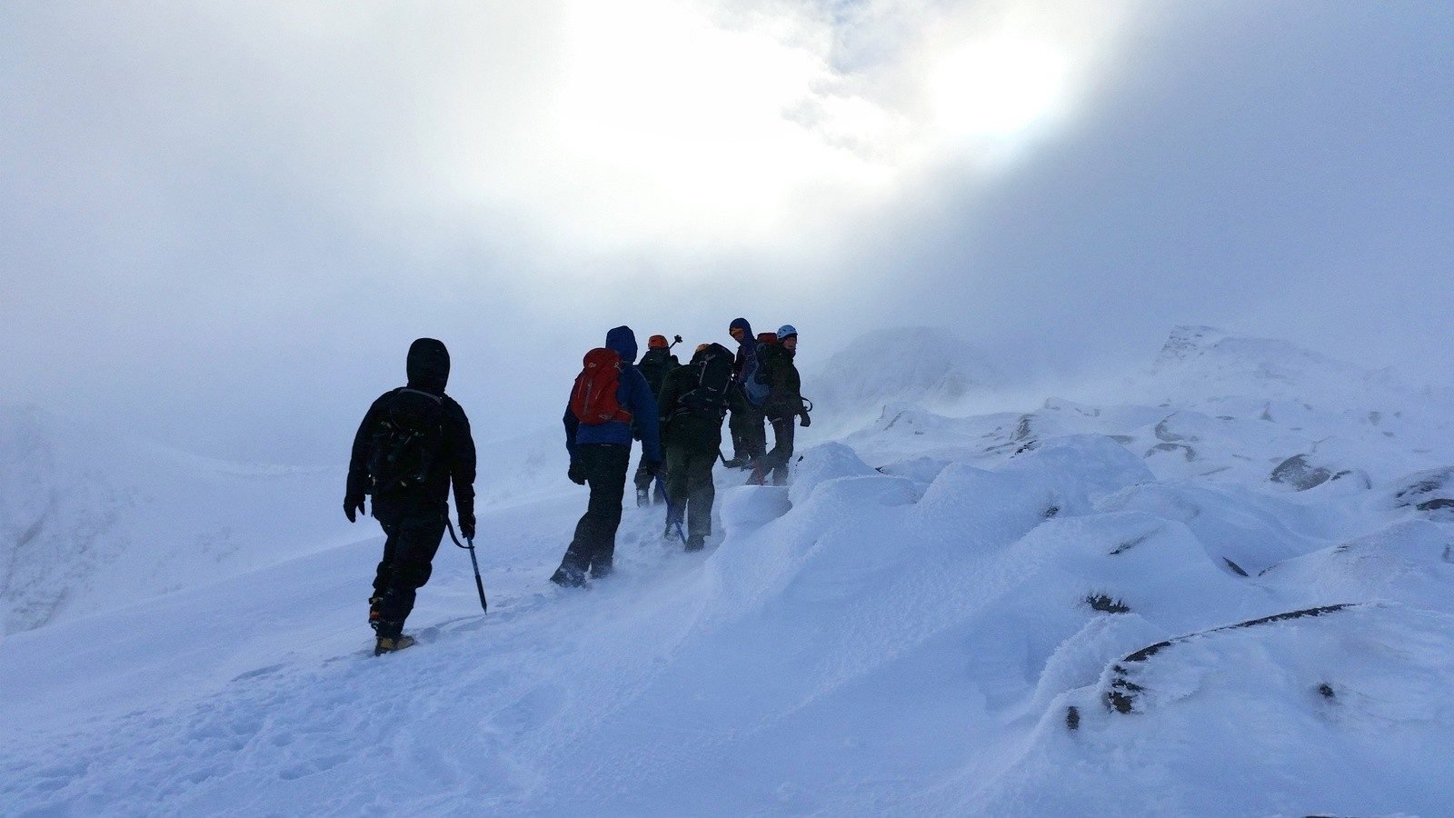 A group hiking in the Cairngorms over winter.