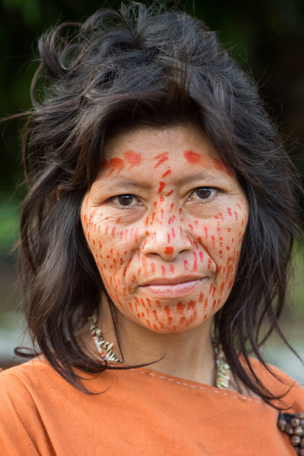 Asháninka woman with traditional Achiote markings.
