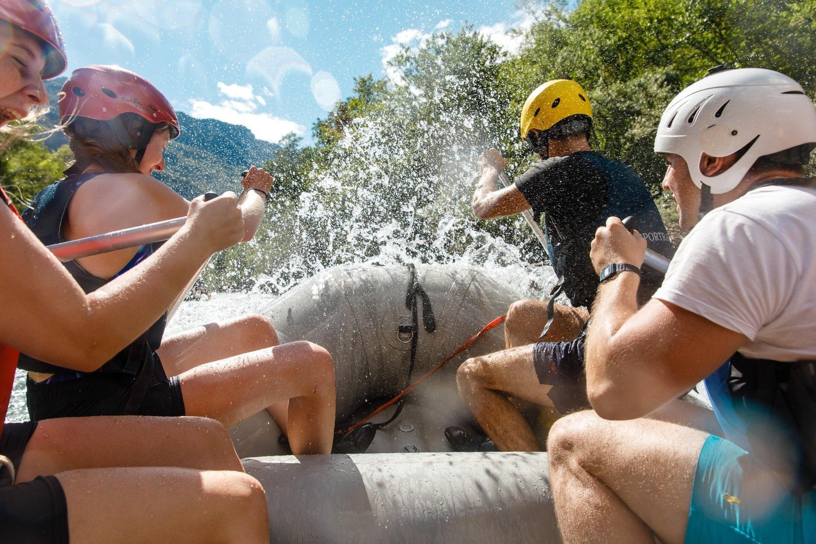 Close up of a rafting group on the Tara River, being splashed by white water.