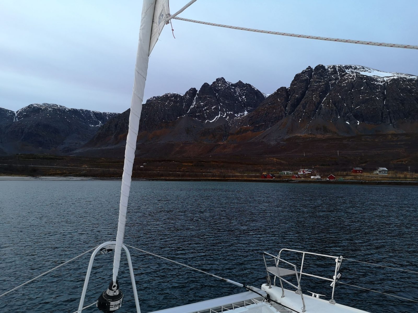 The view of the Norwegian fjords from an Arctic sailing boat.