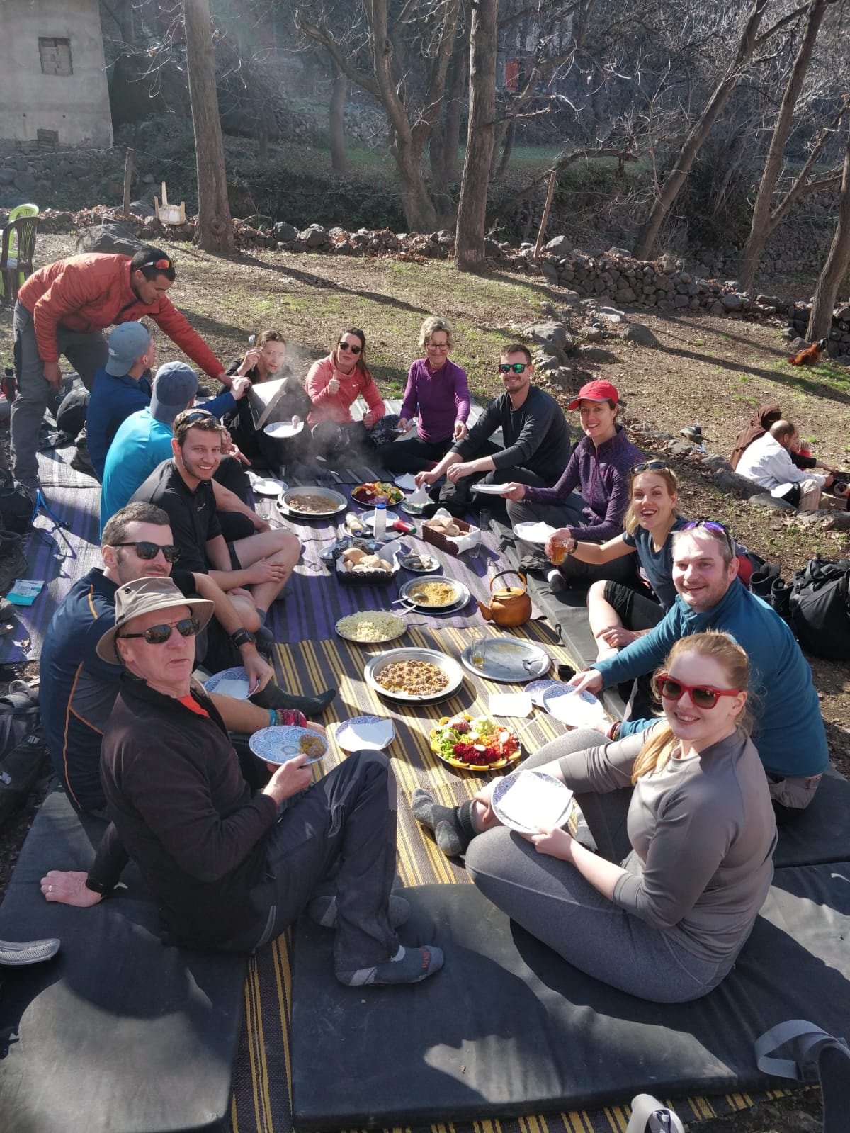 A group sitting down to lunch on the Much Better Adventures' Toubkal trip.