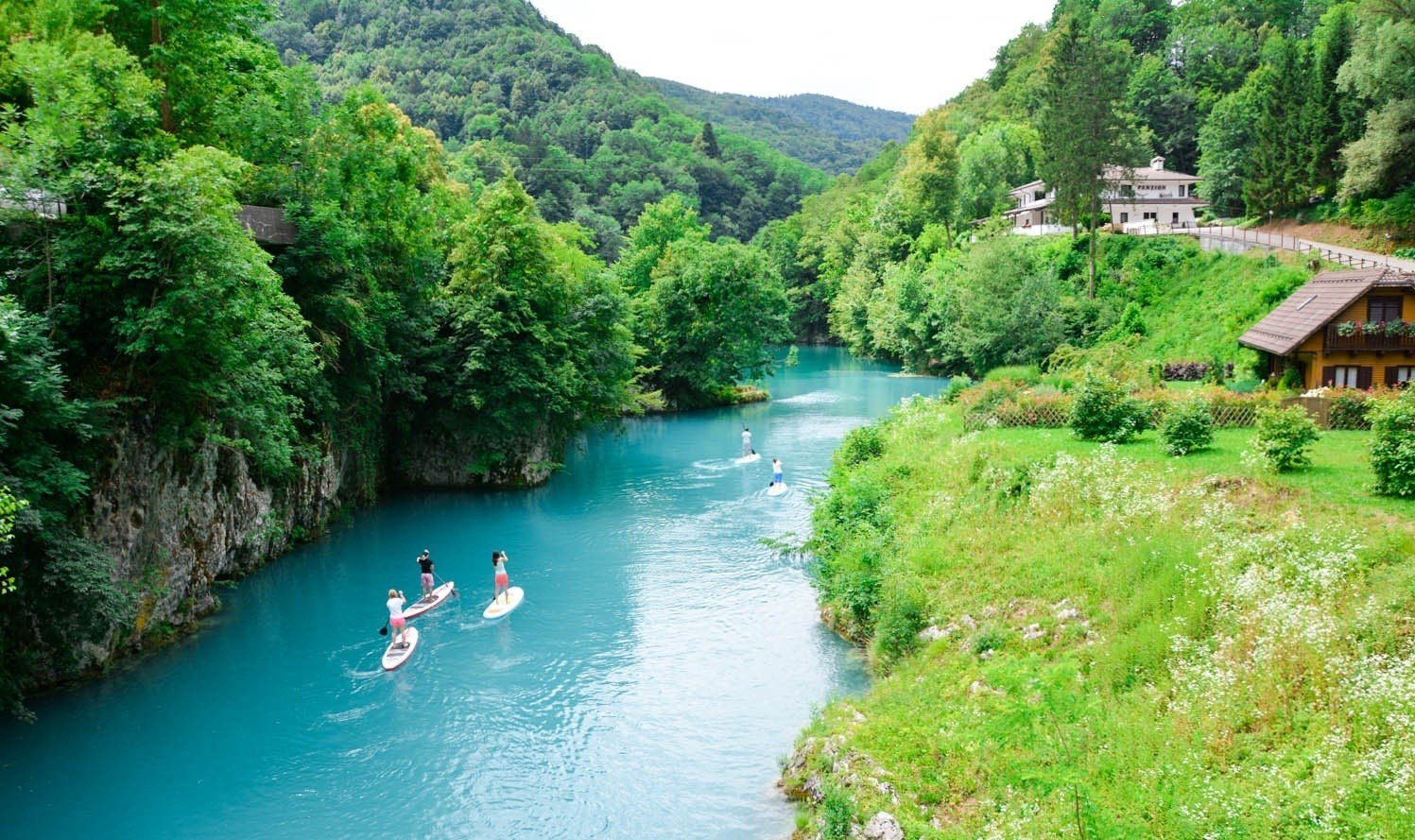 Stand Up Paddeboarders in Slovenia's Soča River