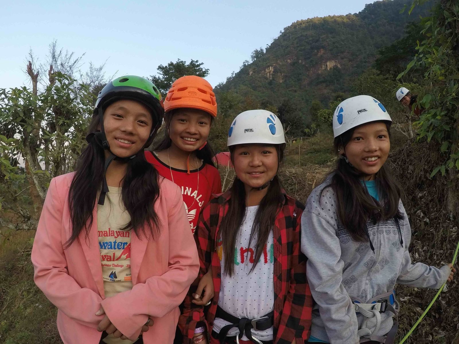 Young Nepalese women pose while on a hike.