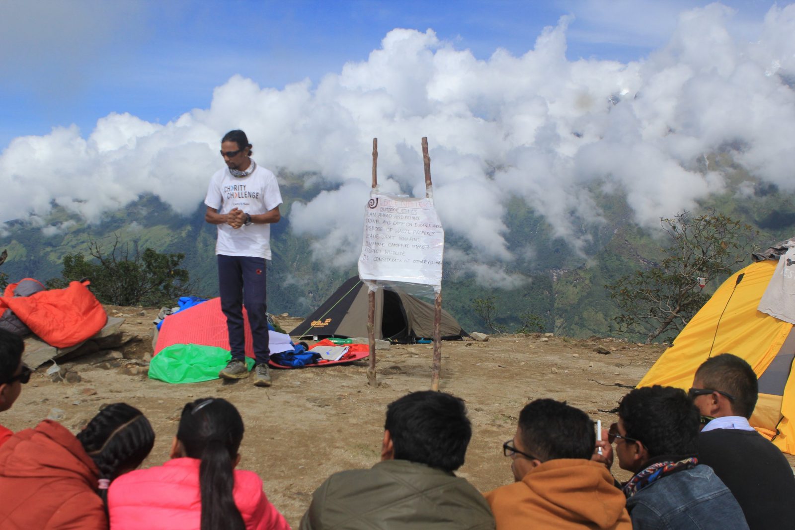 A youth group listening to their group leader at Mardi Base Camp in Nepal.