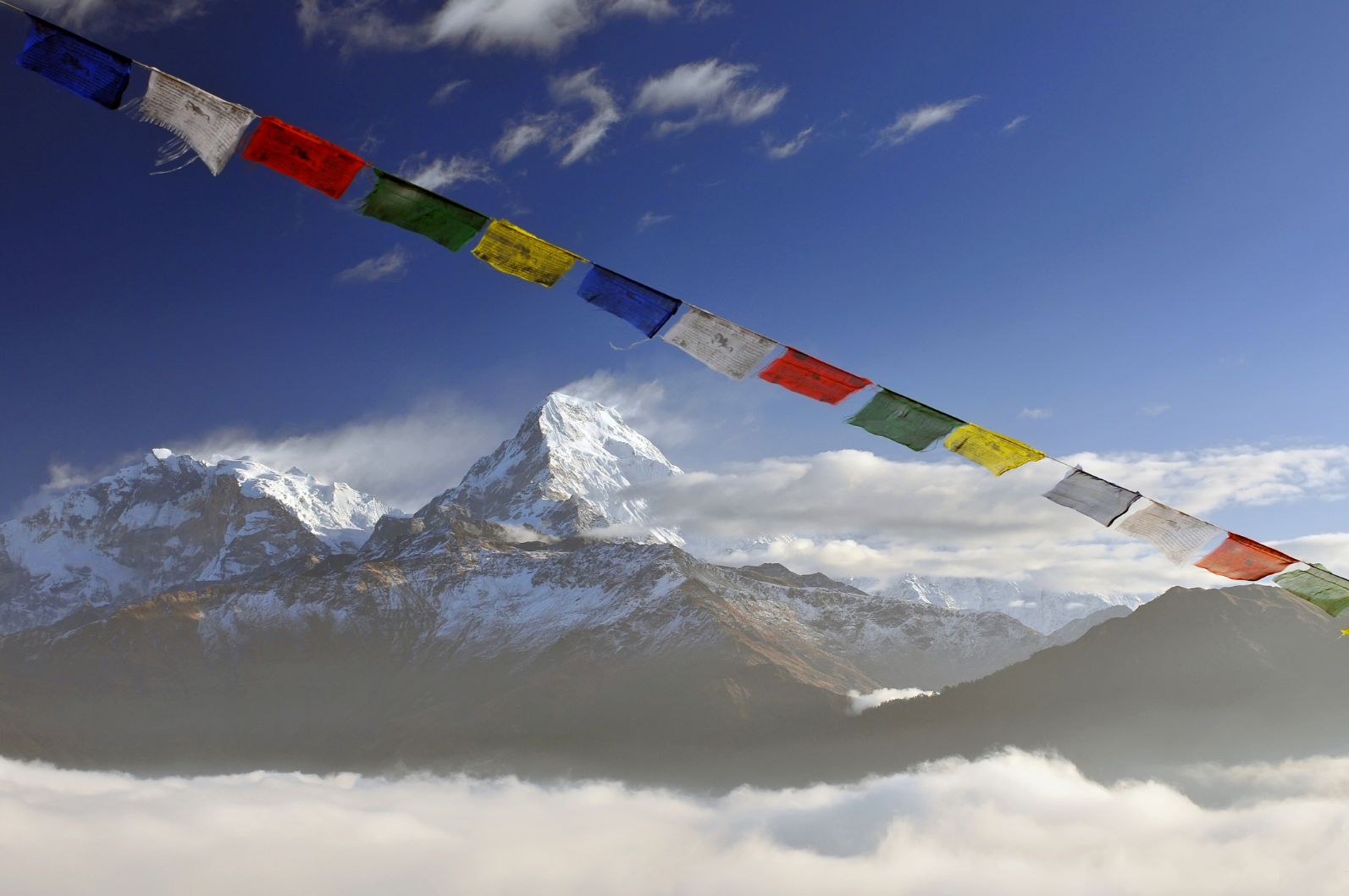 The Annapurna massif, with prayer flags in the foreground.