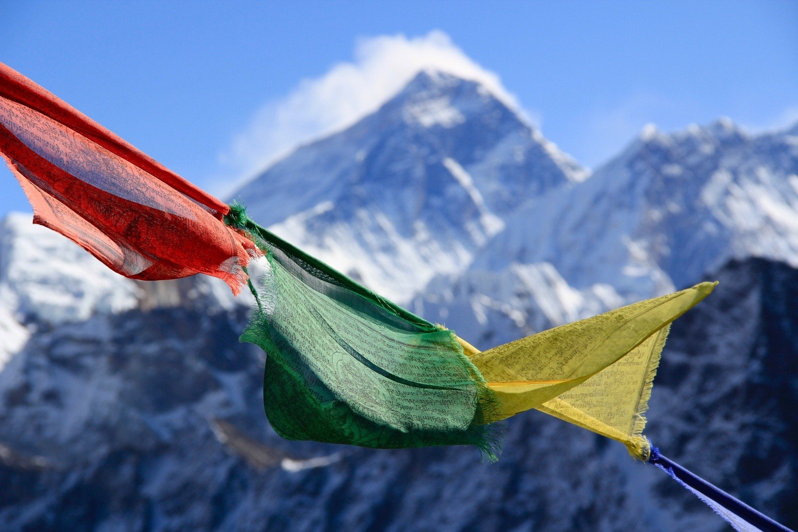 Prayer flags in front of the summit of Mount Everest.