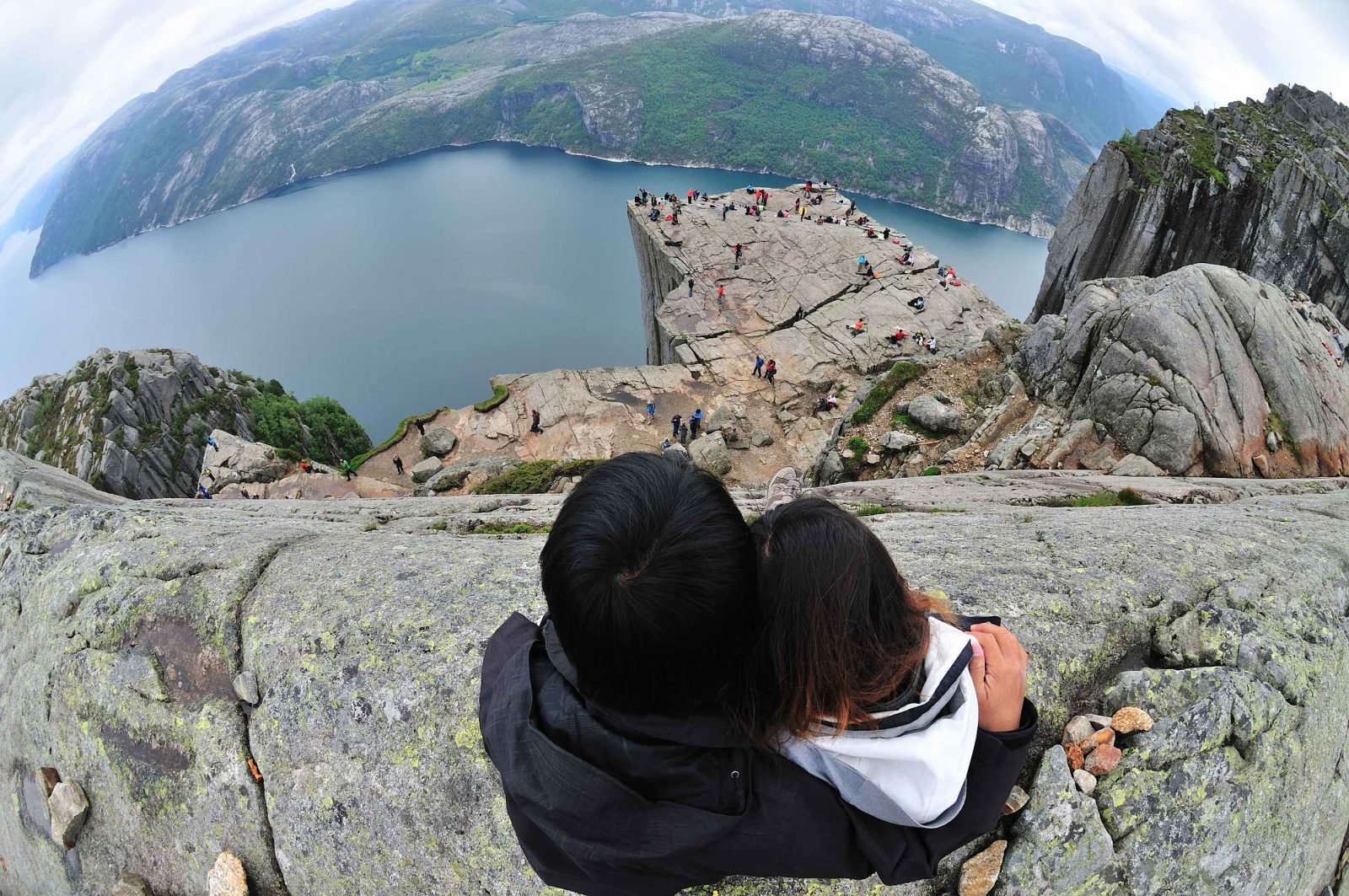 A couple take a selfie on Preikestolen in Norway.