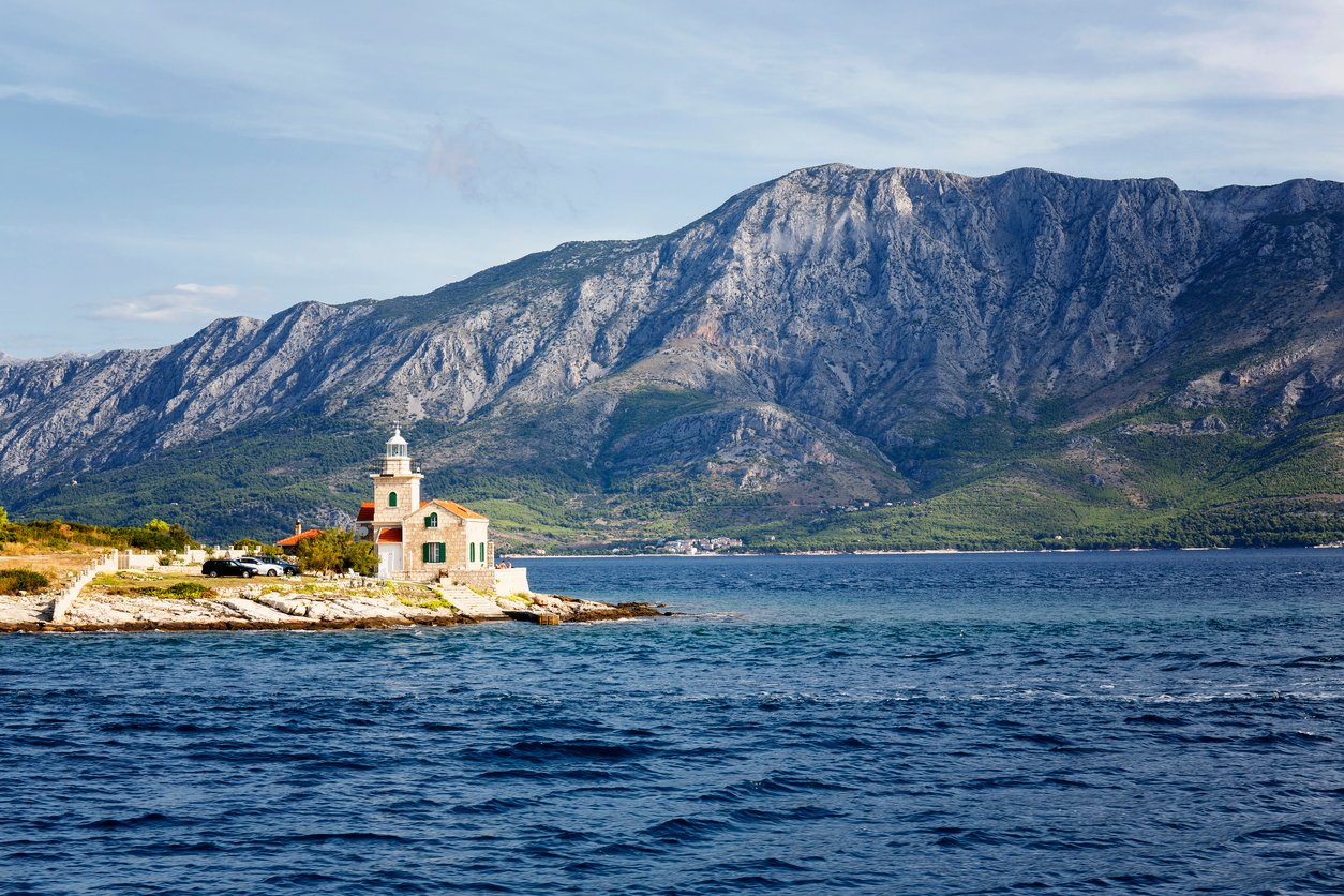 Hvar lighthouse with Biokovo and Makarska Riviera