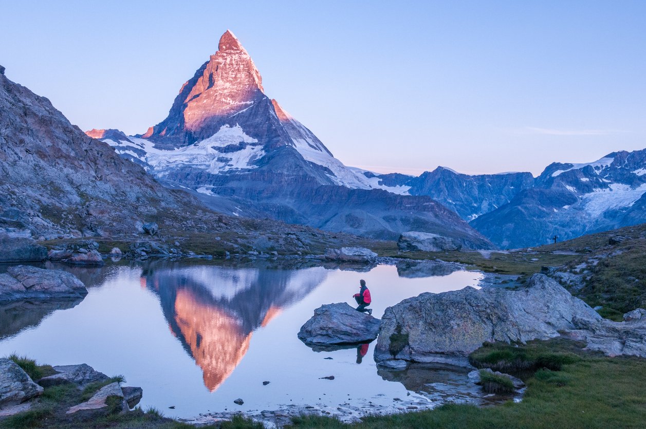 The peak of Matterhorn reflected in a mountain lake, the Swiss Alps
