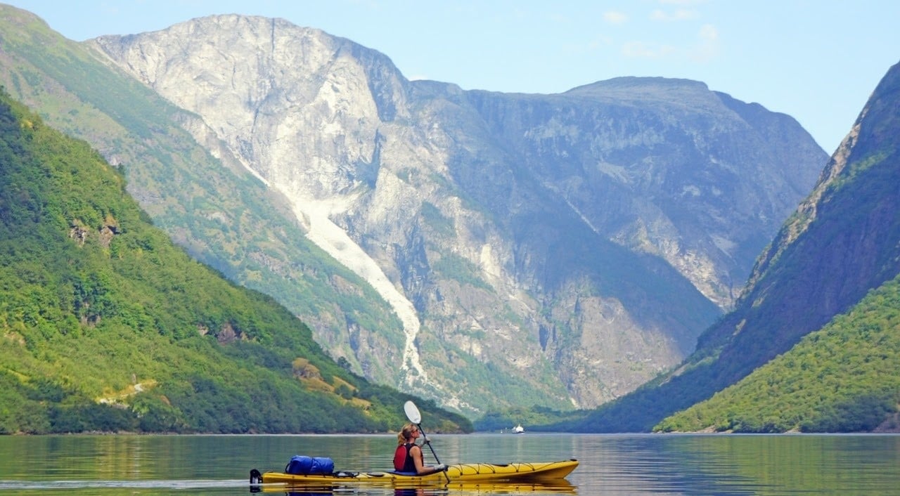 A kayaker in the Norwegian fjords