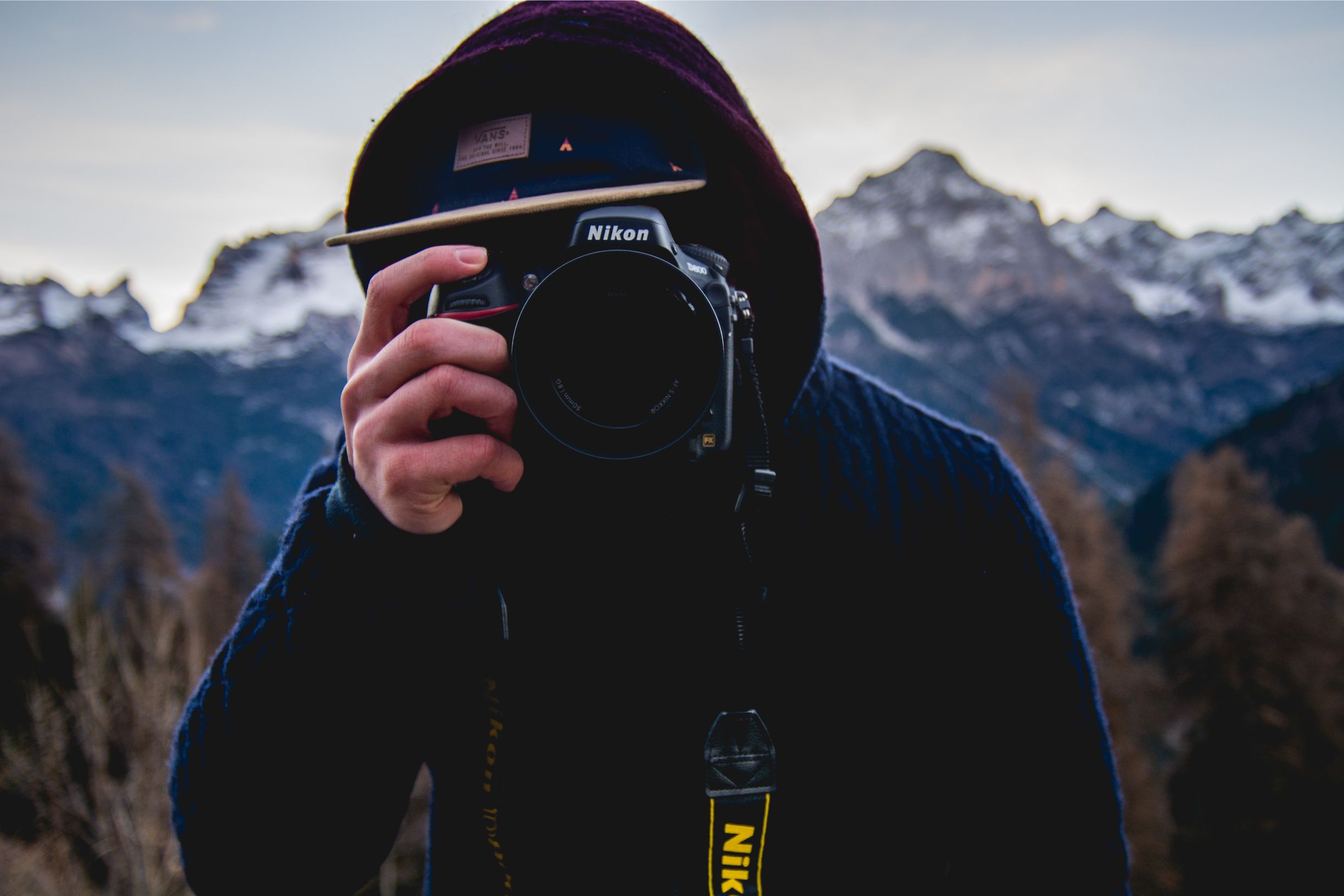 A photographer taking a shot in the Norwegian fjords