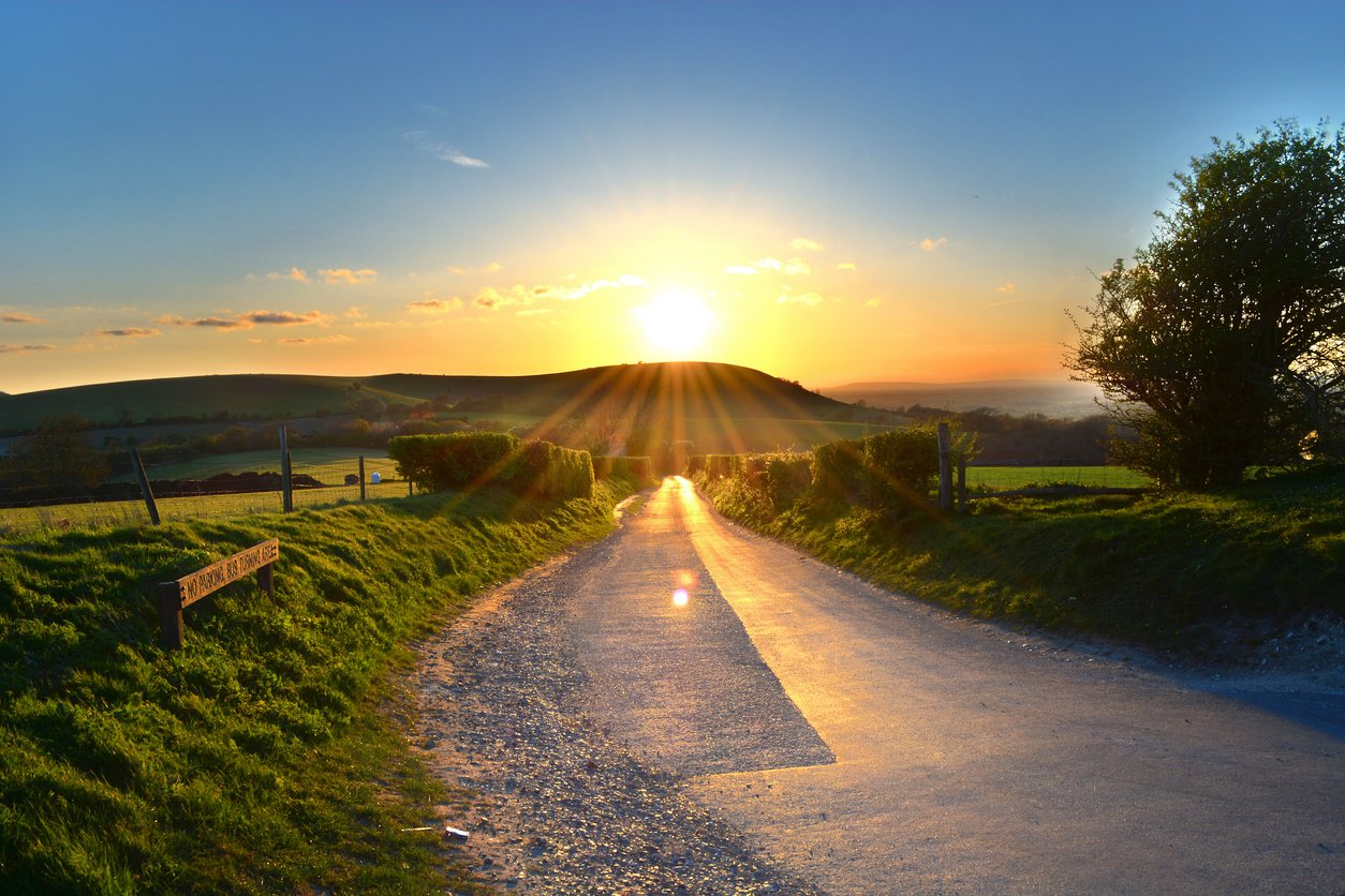 Sun set as seen from the Jack and Jill windmills in Sussex, England on a hike near London.