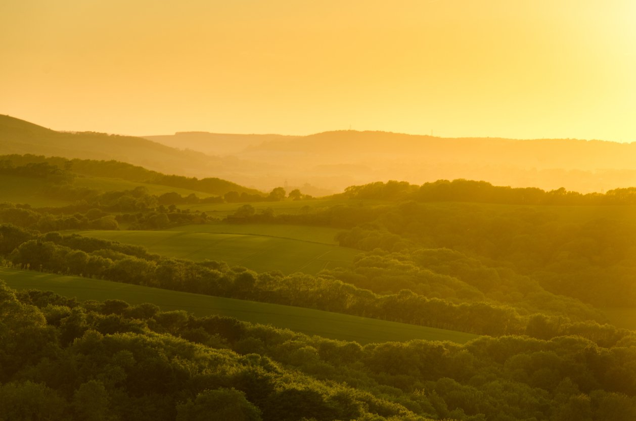 A sunset over the beautiful South Downs National Park, one of the best hikes near London…