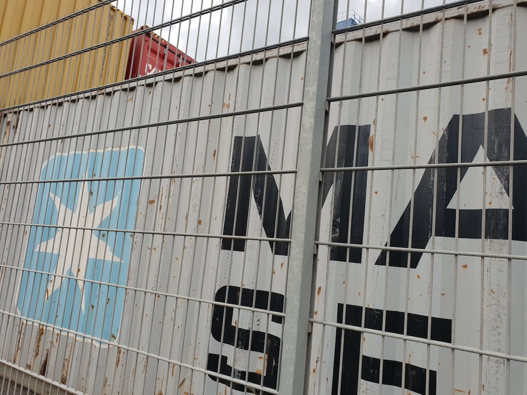 A close up of a container on a barge.