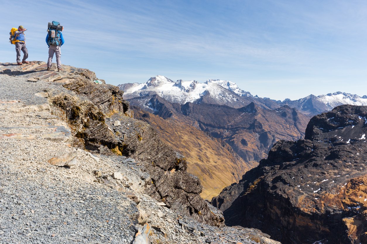 Two hikers pose in the mountains on the El Choro Trek