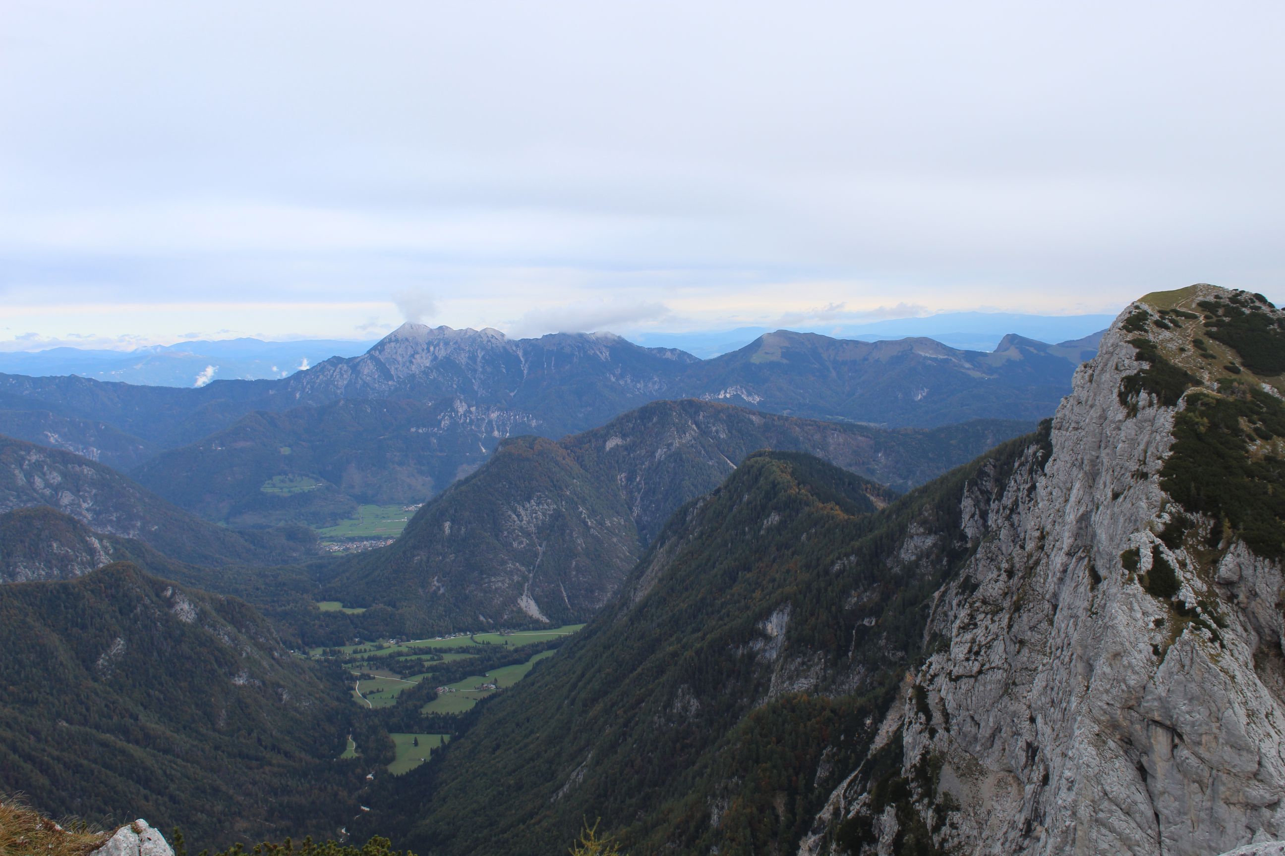 A panoramic view of mountains, taken from the summit of Mount Brda in Slovenia
