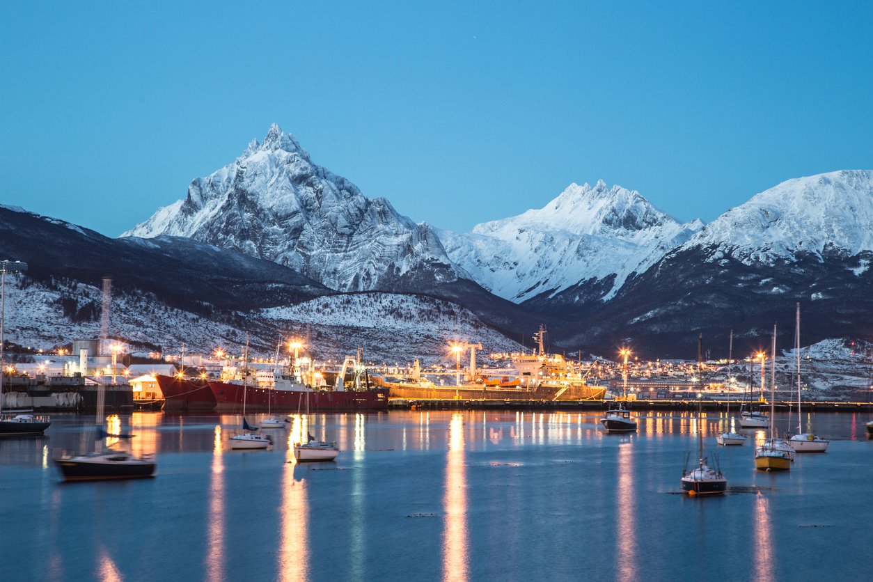 The port city of Ushuaia with high peaks behind in Patagonia.