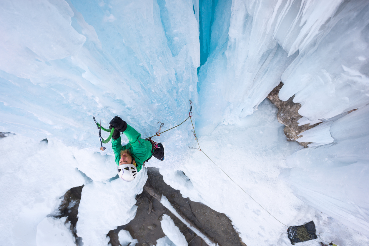 Ice climbing outdoors in winter | iStock: AlexSava