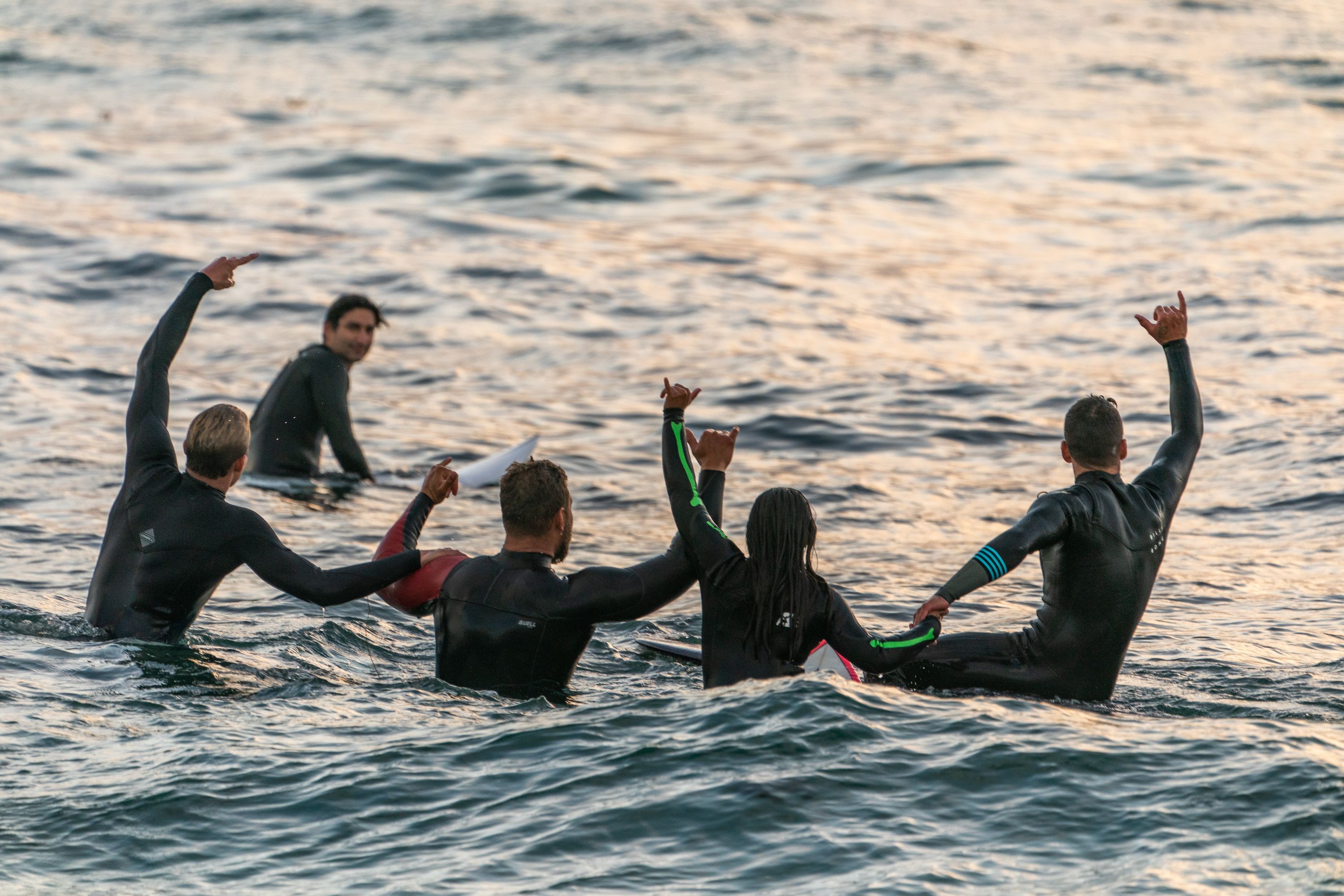 Surfing in a line up in the ocean.