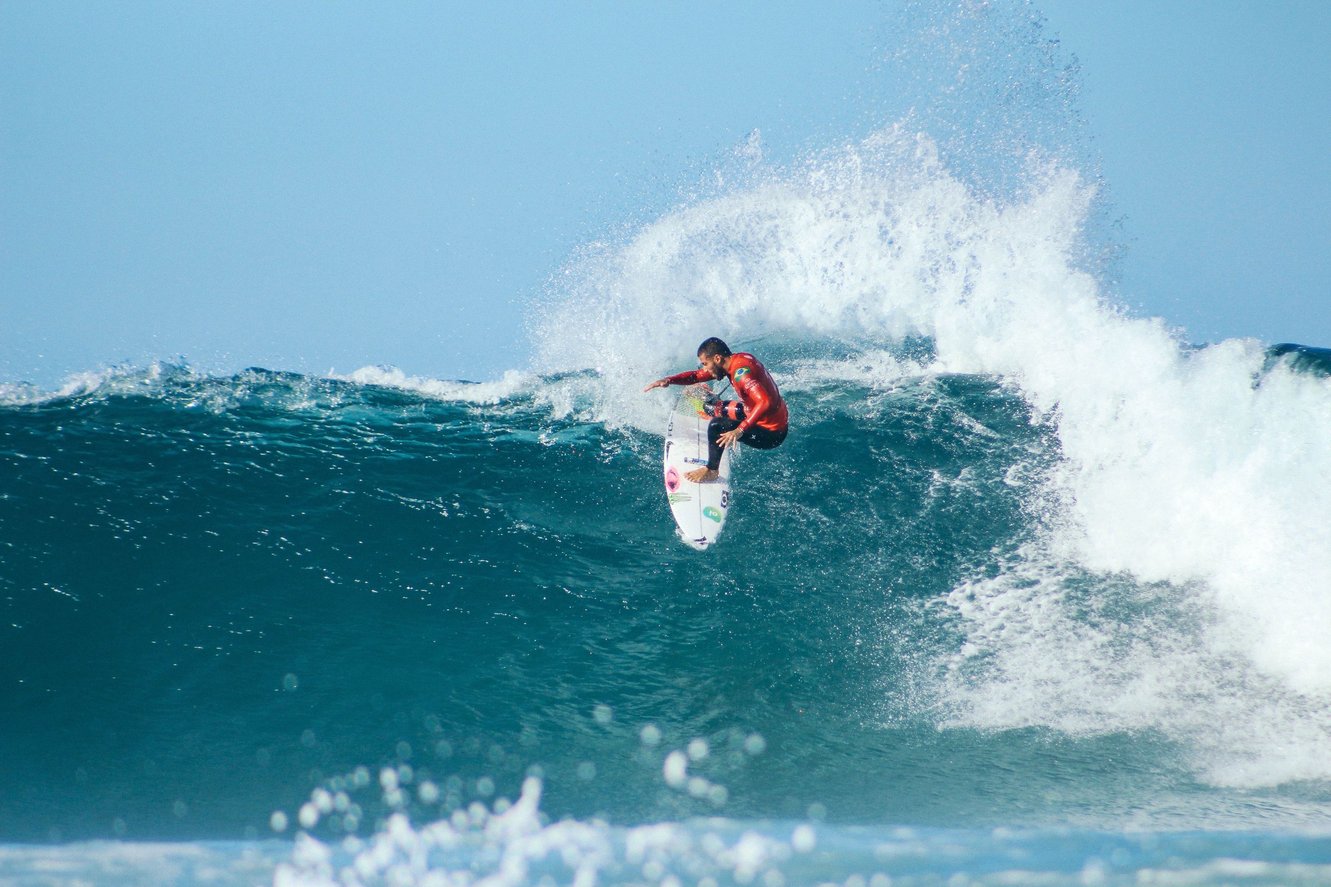 A surfer catching a wave.