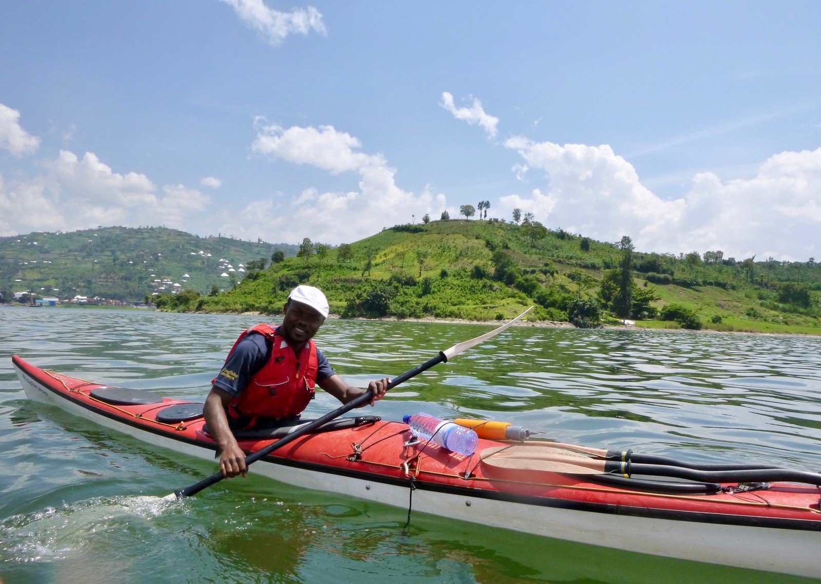 A man kayaking in Rwanda, a place which is under-visited by tourists.