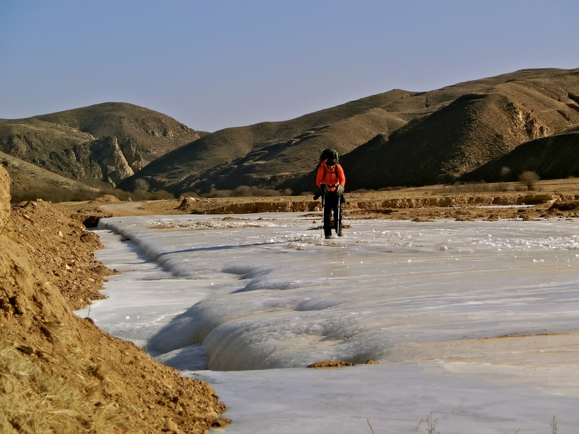 Leon McCarron crossing a remote river in China