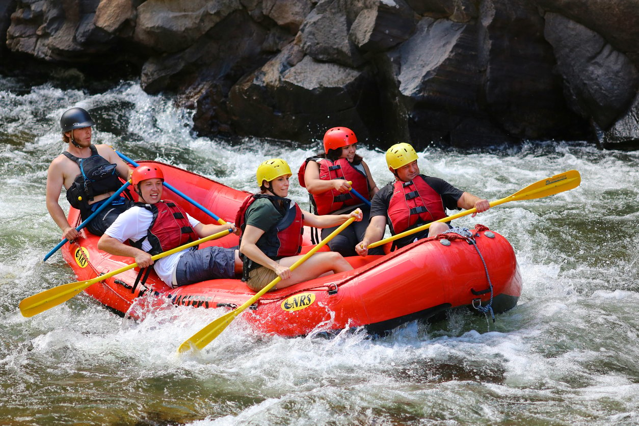 Five people going white water rafting.