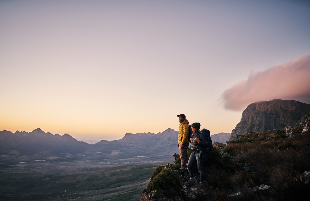 A man and woman hiker in the mountains