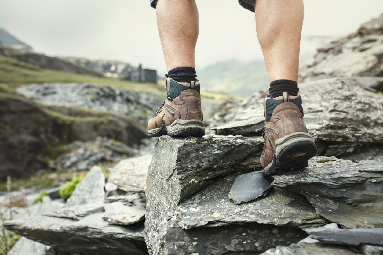 A pair of walking boots on a rock.