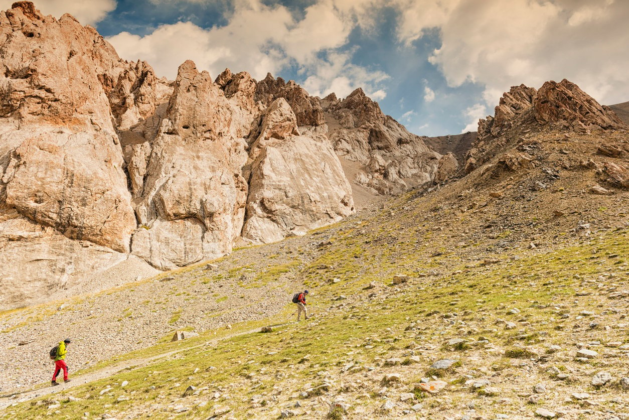Two hikers in the Tian Shan mountains, Kyrgyzstan.