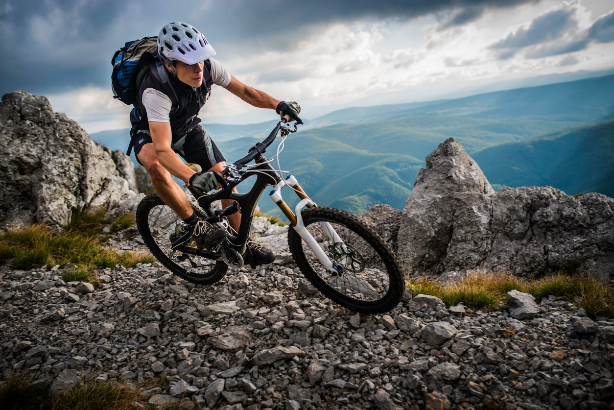 Biker Riding on a Mountain Trail