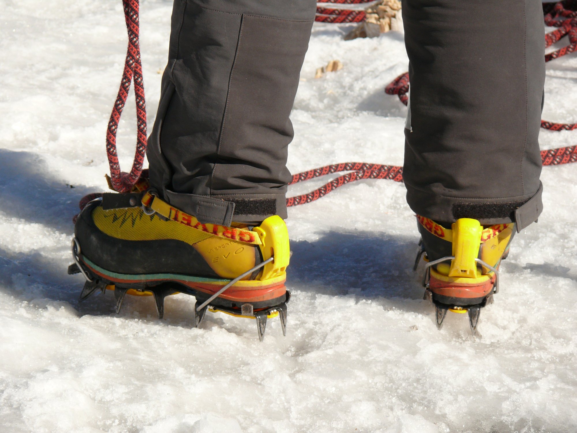 Someone wearing B2 hiking boots with C1 crampons on the ice