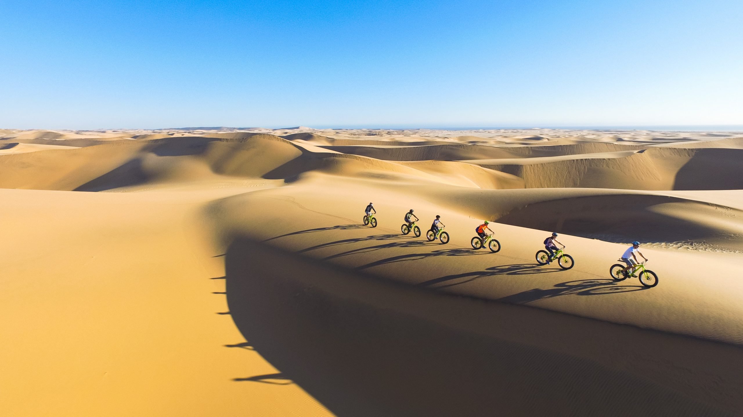 Cycling over the sand dunes of Namibia.