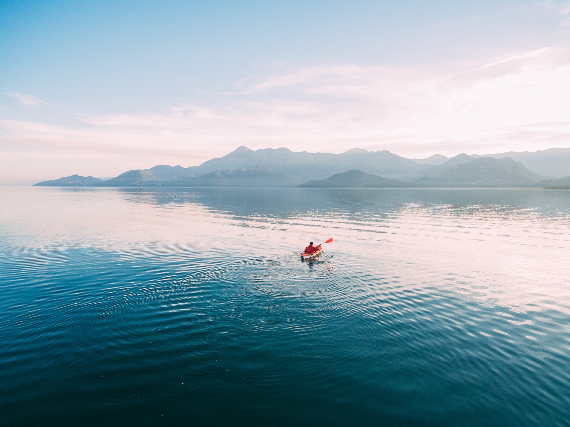 A person kayaking in the lakes of Albania