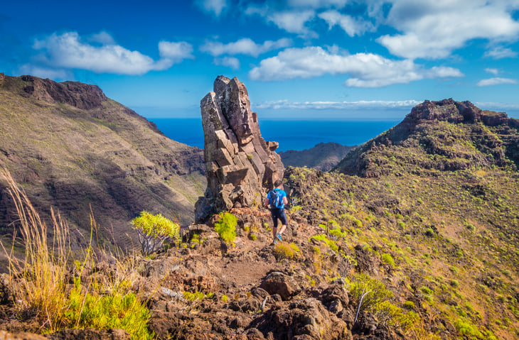 Hiking on a scenic sunny day is one of the best things to do in the Canary Islands. Photo: Getty Images