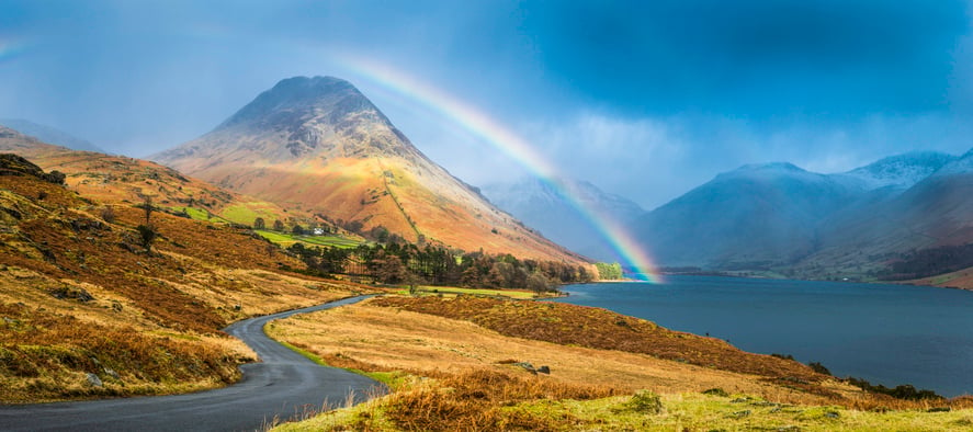 A rainbow over a mountain.